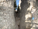 Take a left and climb up through the gap