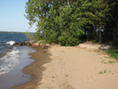 Leave the beach and follow the paved path left along the shore