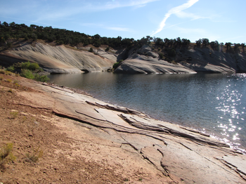 Sparkly water and slickrock dunes