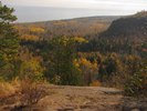 Gray Lake Superior and a full colored woods